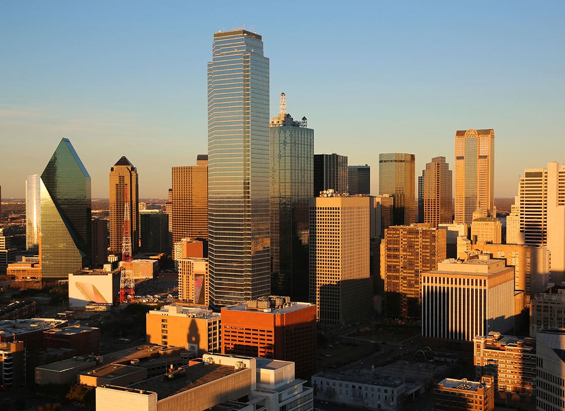 Dallas, TX - Aerial View of Commercial Buildings in Downtown Dallas Texas at Sunset